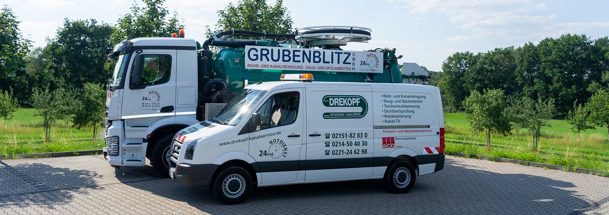 Dienstfahrzeuge der Firma Drekopf und Grubenblitz